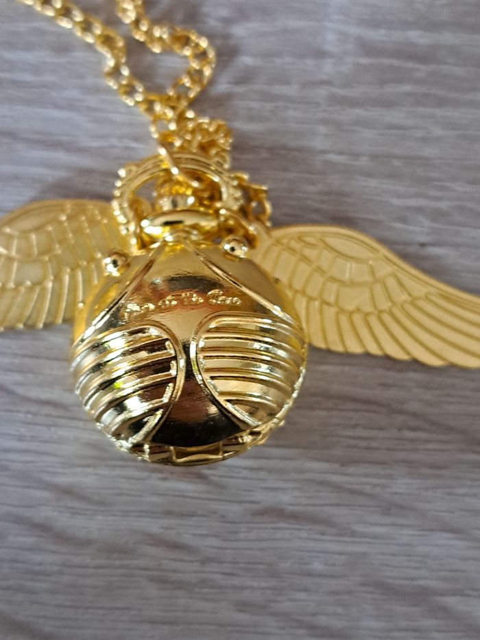 Montre pendentif Harry Potter Vif d' or vendue avec une pochette - photo numéro 3