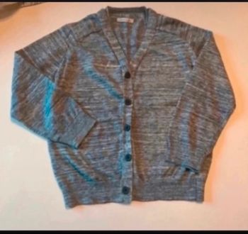 Gilet pour fille très bon état taille 8 ans couleur gris