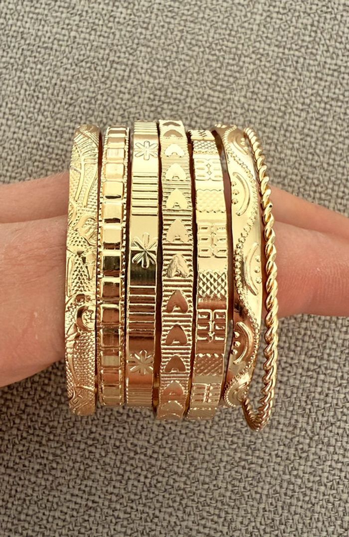 7 Bracelets ouverts dorés acier - photo numéro 2