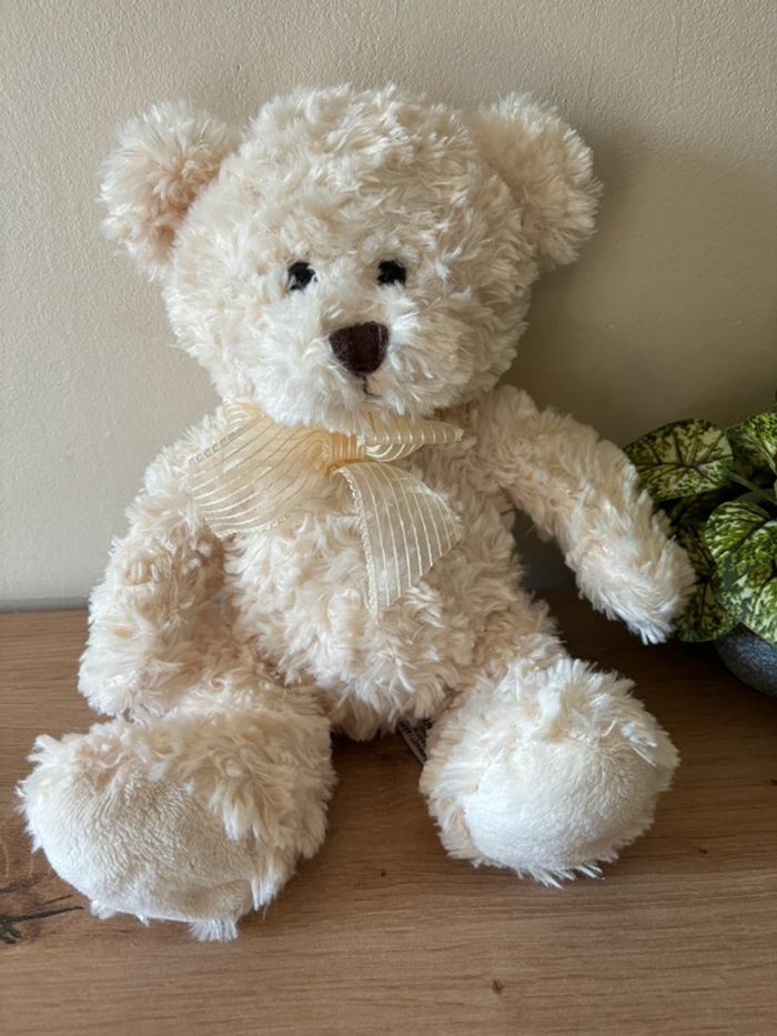 Doudou peluche ours écru noeud Teddy kompaniet