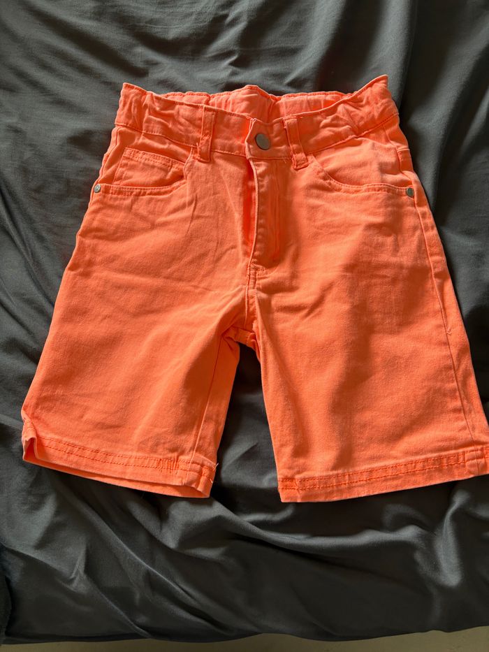 Short pression orange 134cm 9 ans