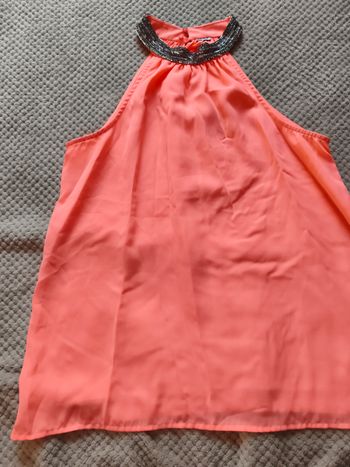 Blouse sans manche avec cou fantaisie doublé devant 