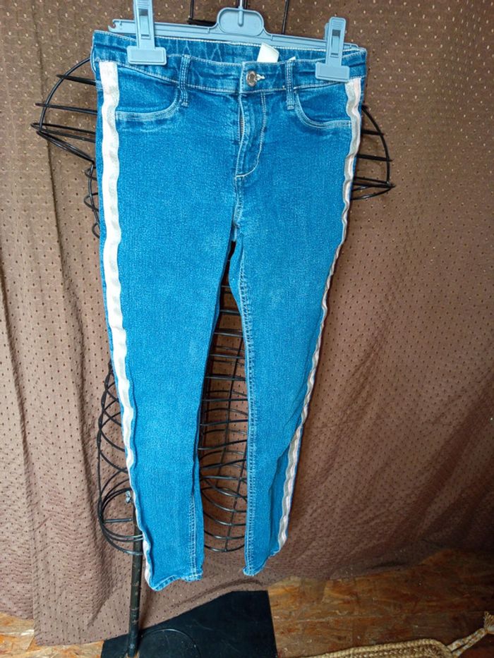 Jeans au bords rose taille 10/11ans