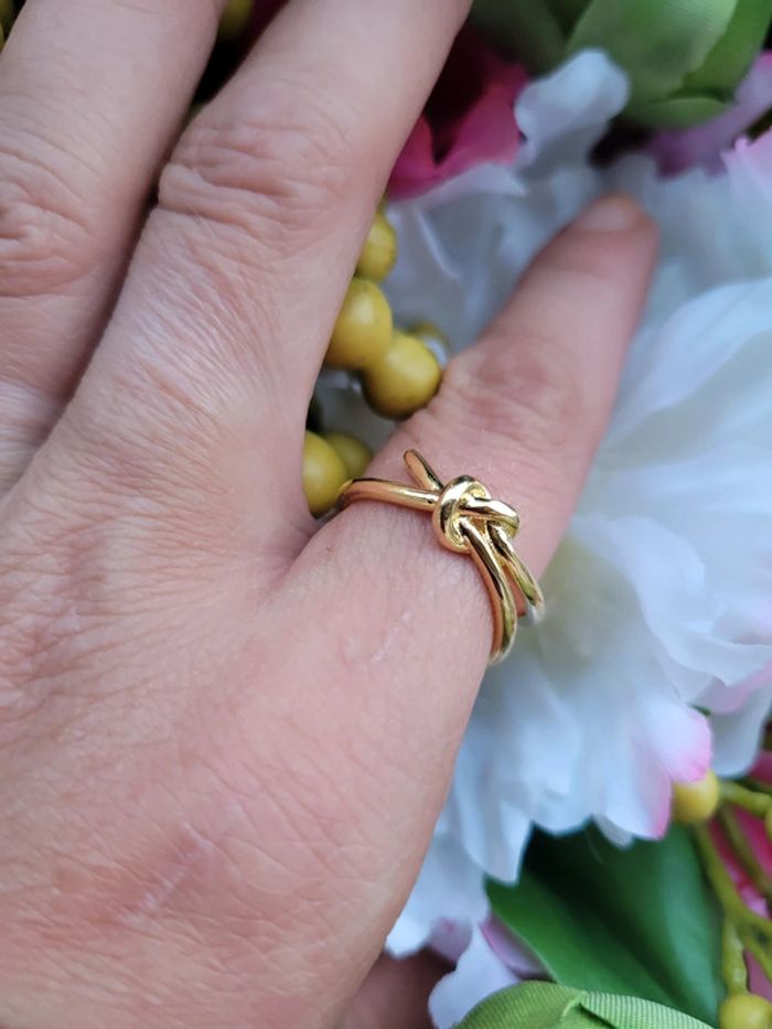 Bague nœud coupé acier gold