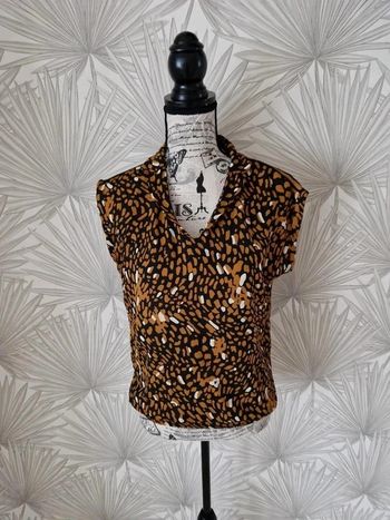 Jolie blouse sans manches taille 36