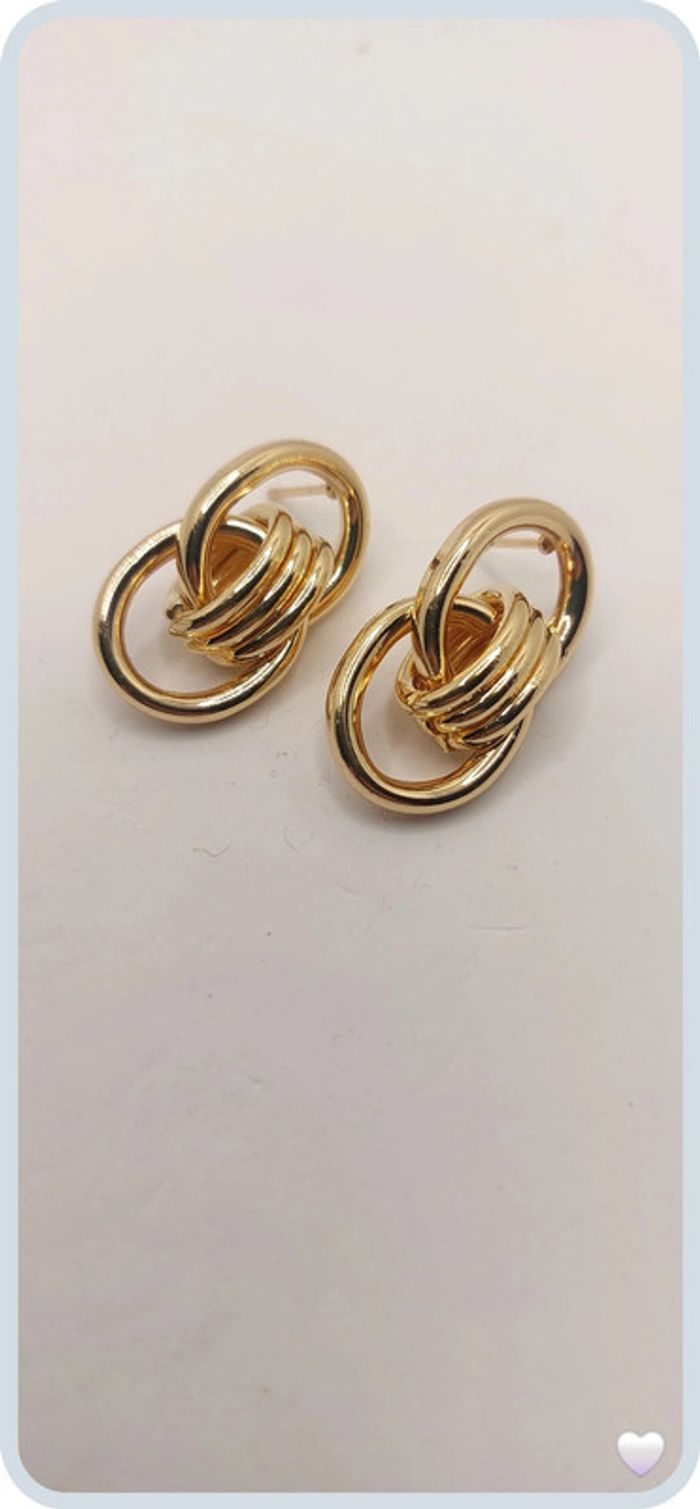 magnifique boucles d oreilles en acier dorée