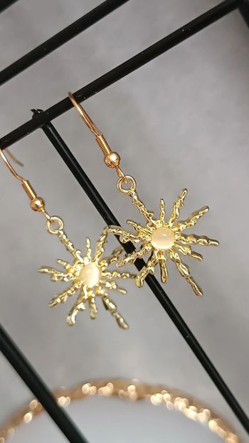 Jolies boucles d'oreilles soleil