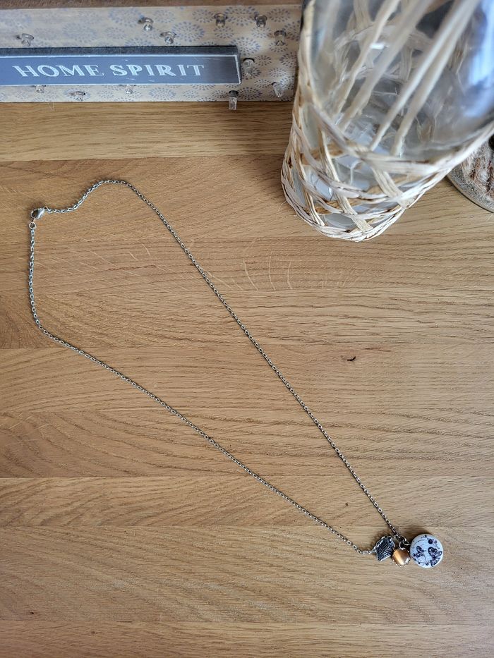 Collier sautoir argenté avec breloque
thème papillon - photo numéro 3