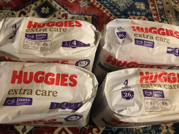 Neuf lot de 4 paquets de couches huggies extra care taille 4 soit 104 pants - photo numéro 3