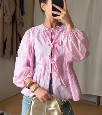 Blouse rose rayée à noeuds