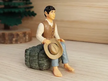 Schleich personnage homme au chapeau assis