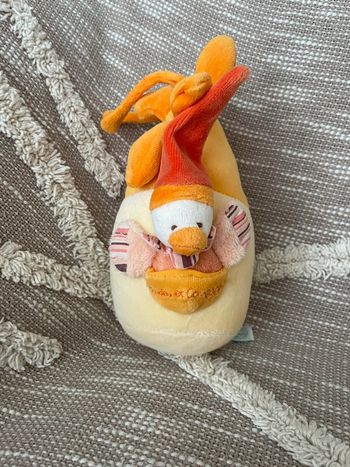 Peluche musical 20cm doudou et compagnie oiseau canard orange et blanc très bon état