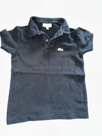 Polo Lacoste noir 4 ans.