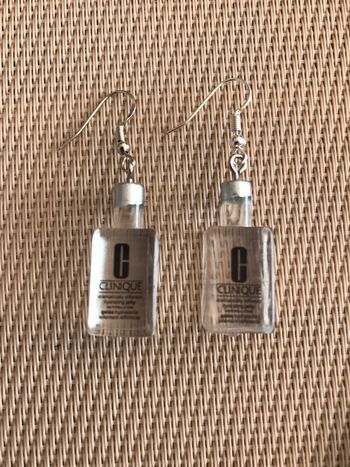 Boucles d’oreilles flacons Clinique