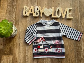 - Haut ML    - 3 mois  - bon état, petite tache