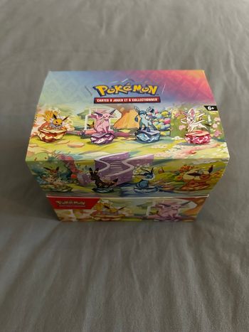 Display Pokémon Mini-tins EV8,5 Évolutions Prismatiques