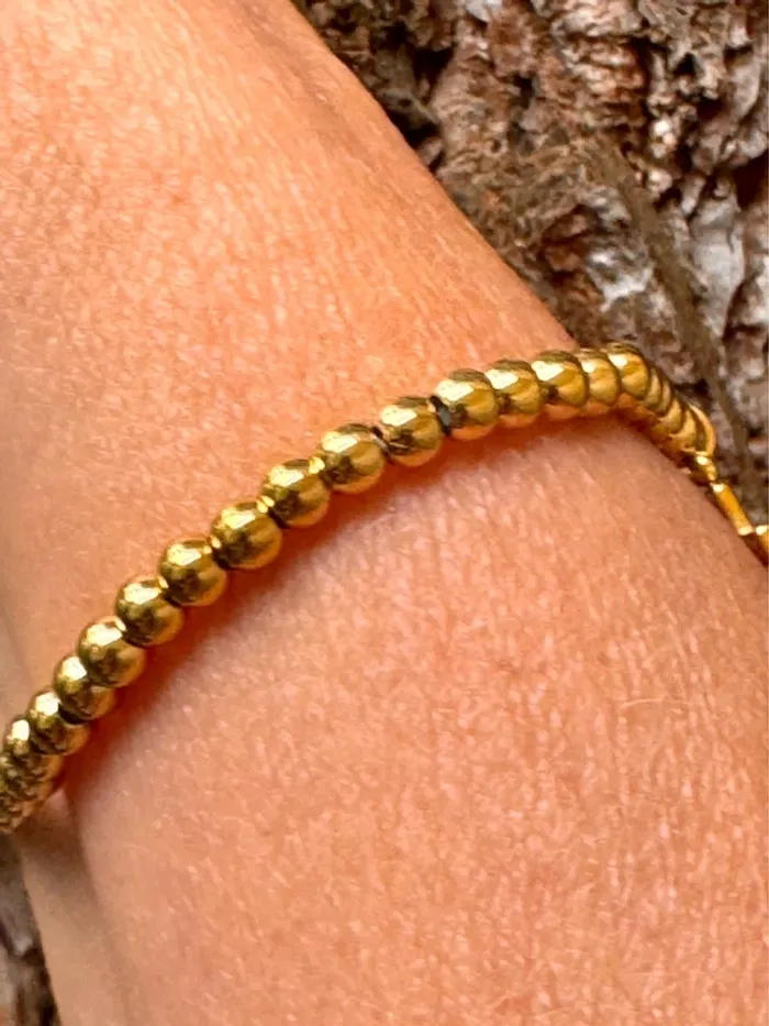 Bracelet réglable acier inoxydable or boules remplies breloque croix cristaux blancs - photo numéro 3