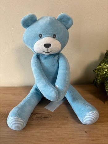 Doudou peluche ours bleu assis velcro bras Tom kiddy