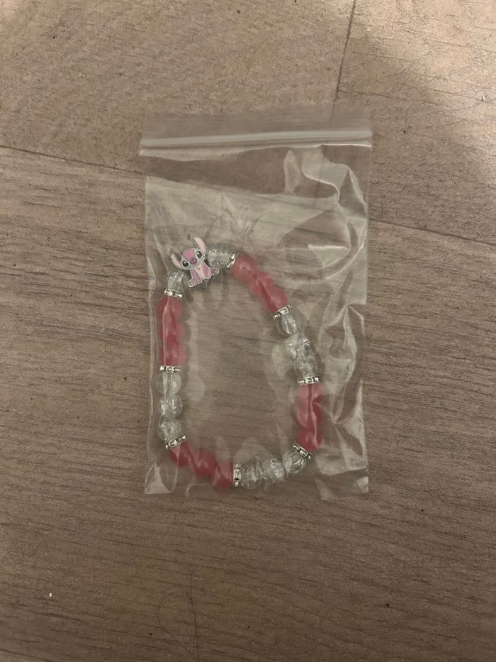 Bracelet Stitch perles rose neuf