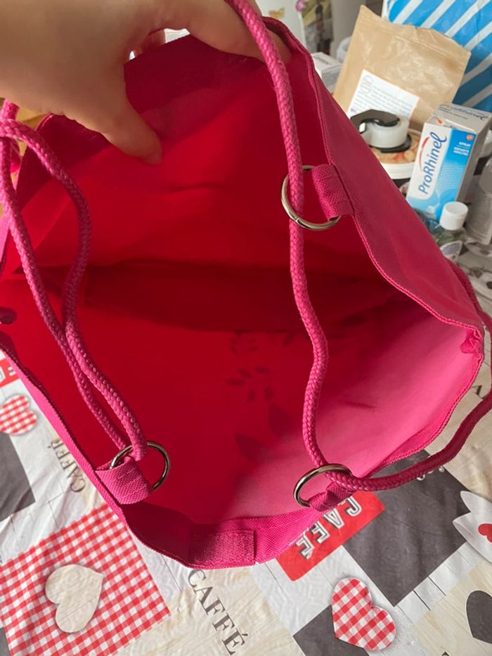 Sac rose à motifs blancs. - photo numéro 2