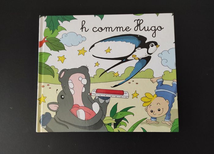 📘 Livre H comme Hugo – Très bon état