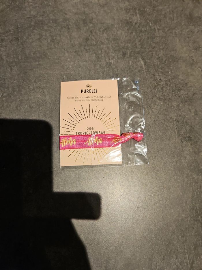 Bracelet élastique rose "Aloha" neuf