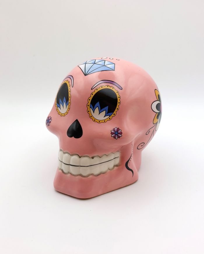 Tirelire tête de mort céramique rose Puckator style mexicain comme dans le film Coco hauteur 10 cm