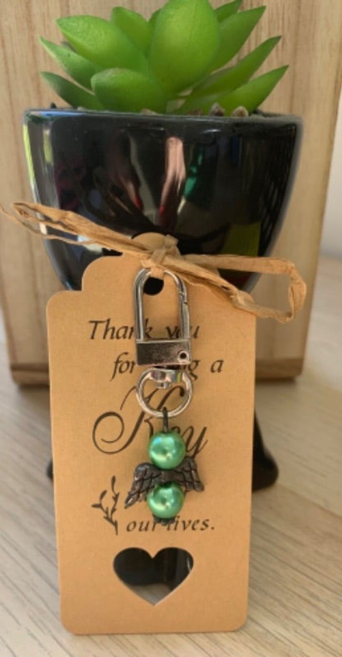 Bijou de sac ange avec perles vertes