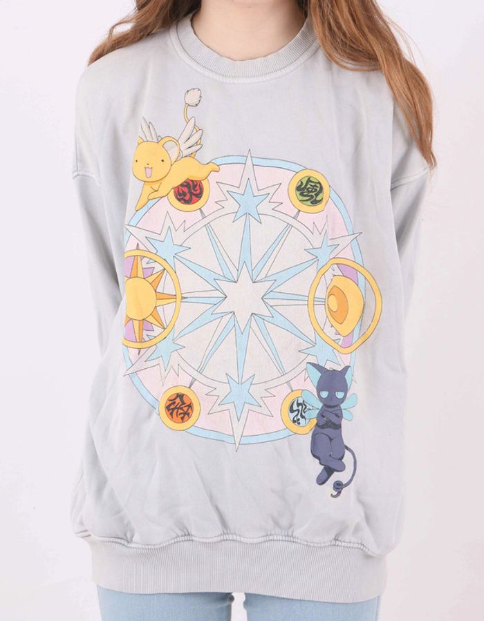 Pull Oversize Sakura, chasseuse de cartes