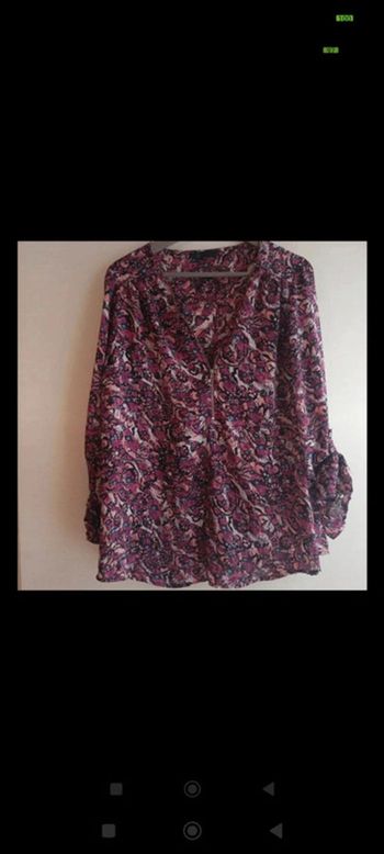 Blouse prune à motifs  avec manches très bon état TU