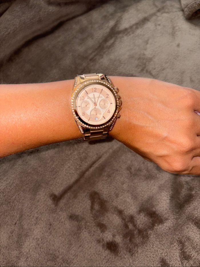 Montre Michael Kors rose doré en bon état