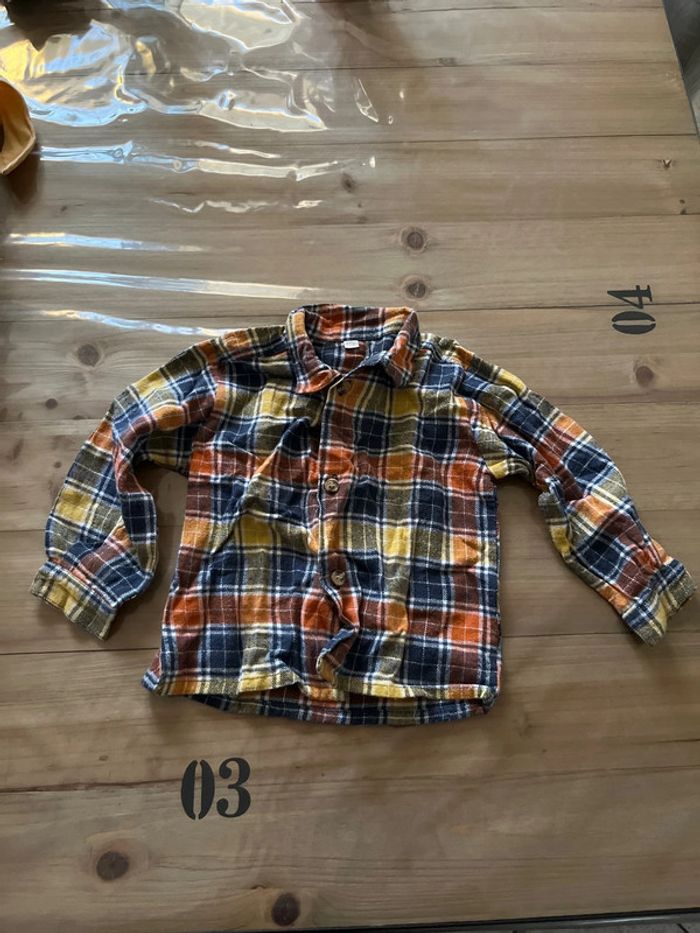 Chemise à carreaux orange et bleu 12 mois