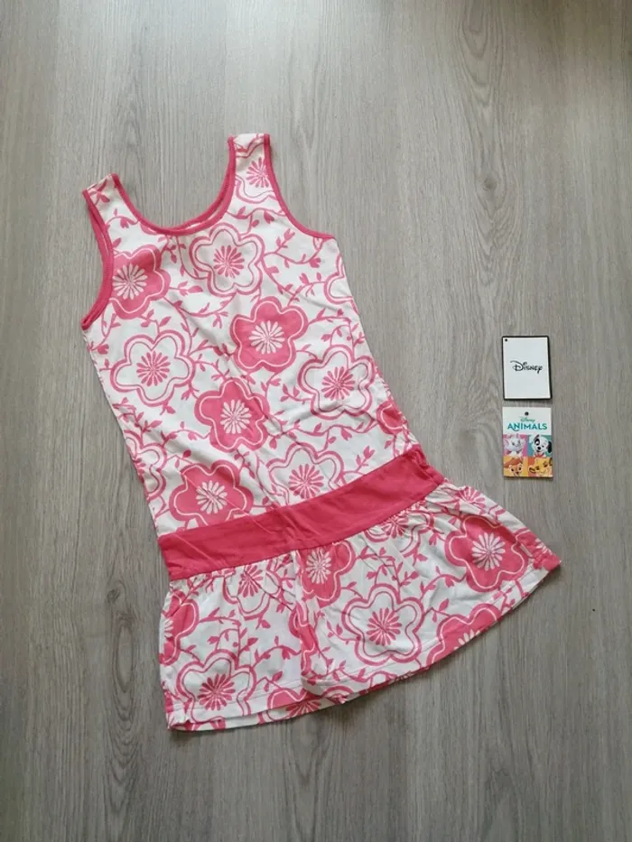 Tunique sans manche blanche à volant avec motifs fleurs corail / plus / (6ans)