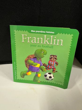 Livre franklin joue au football