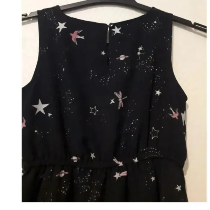 Robe pour les fêtes- motifs étoiles planète oiseaux bretelles taille 7/8 ans - photo numéro 2