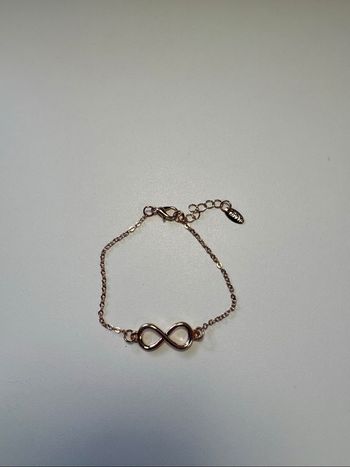 Bracelet avec motif infini doré rose