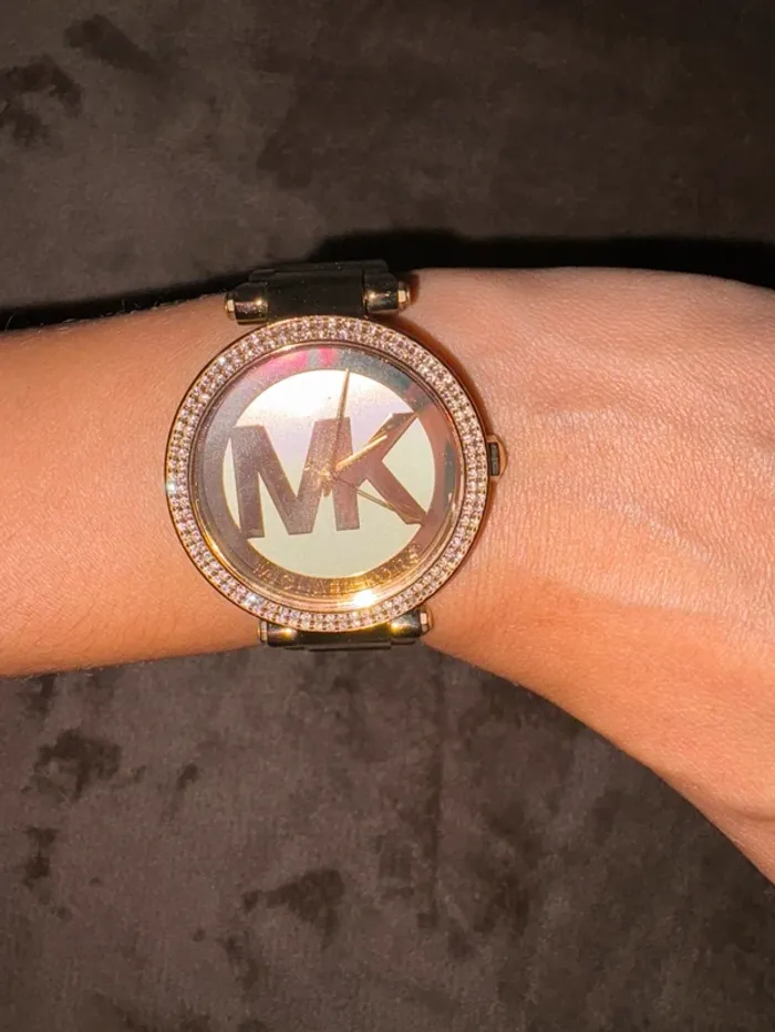 Montre femme Michael Kors doré en bon état