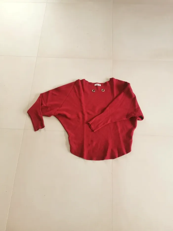Pull rouge chauve souris taille M