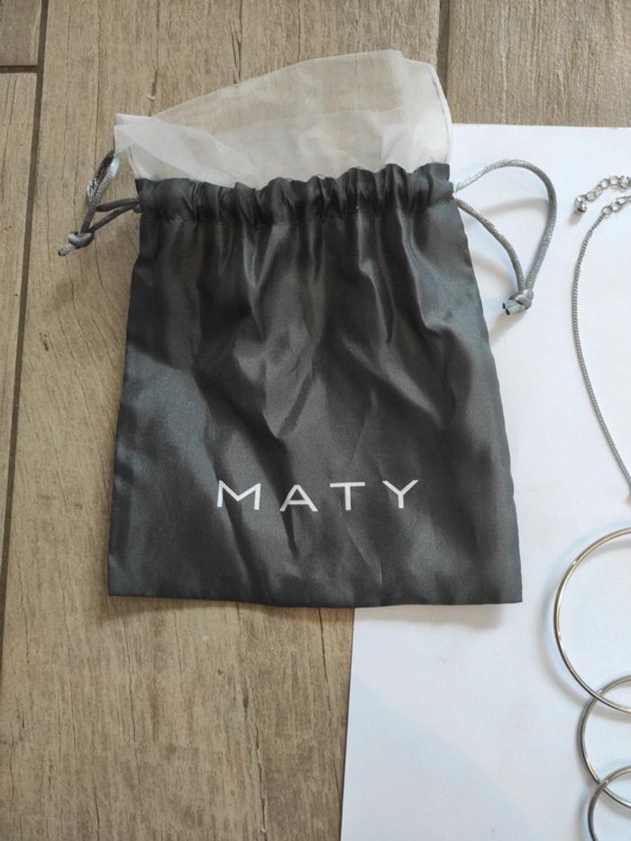 Collier argenté avec 3 anneaux neuf - photo numéro 4