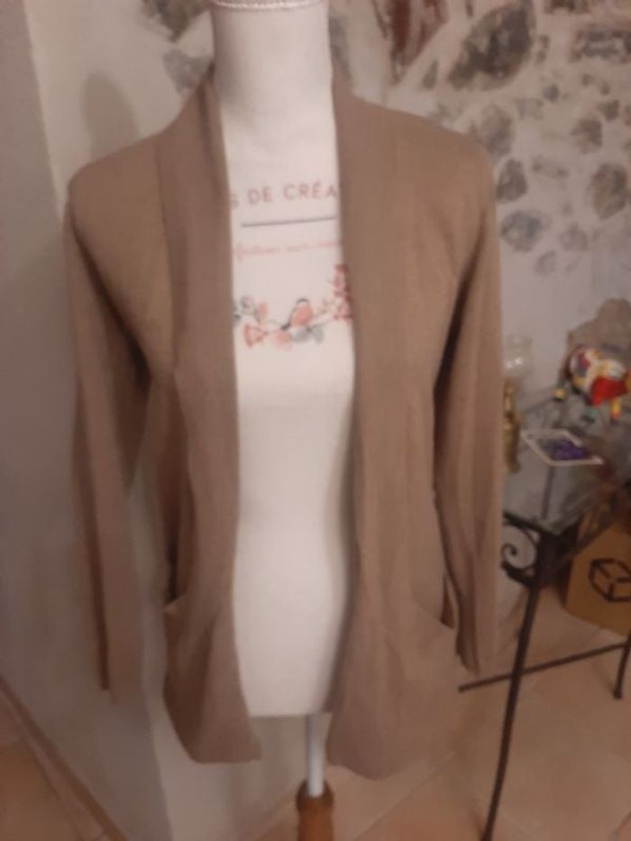 Gilet longueur 64 cm.
