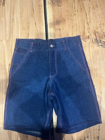 Short stussy taille 38 logo fuschia