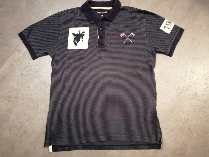 Polo rayé noir et gris Taille M