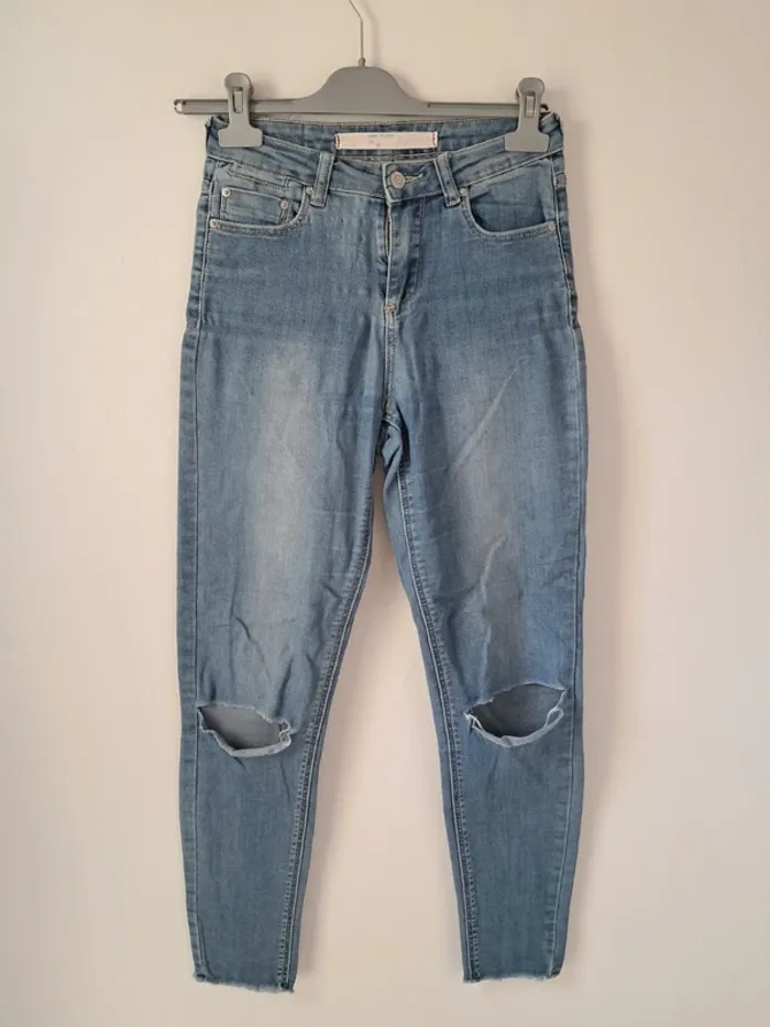 Jean déchiré bleu taille haute tendance