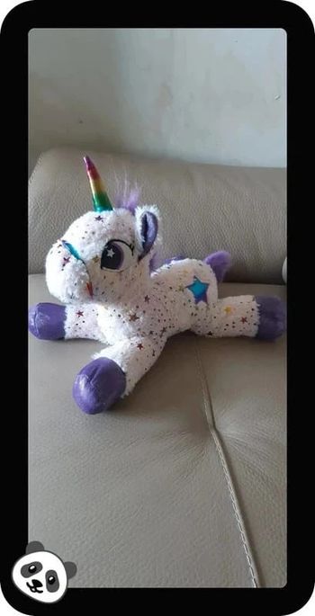 Peluche licorne rose clair/violette en très bon état
