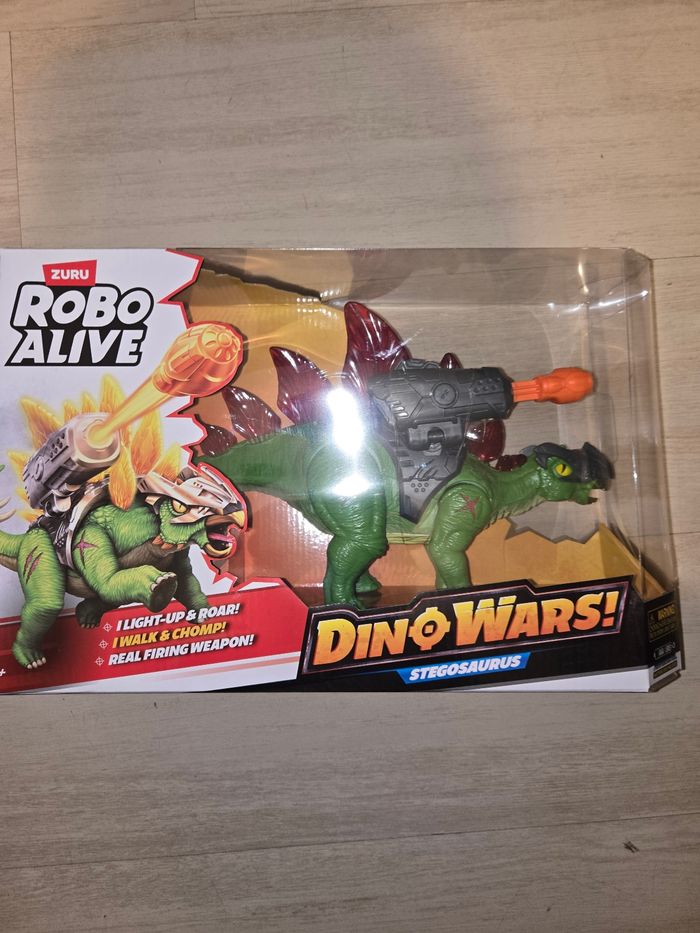 Dinosaure qui tire avec sons et lumières neuf