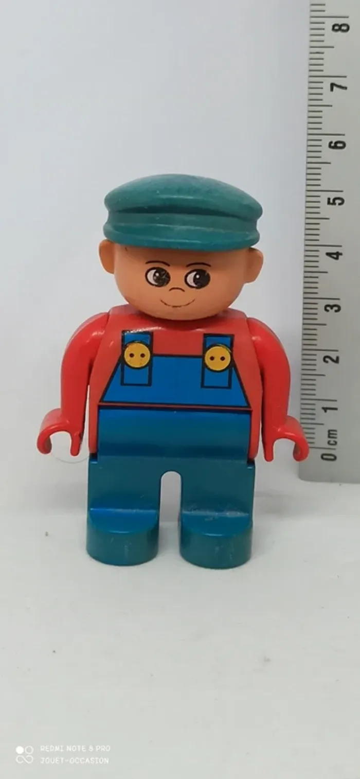 Homme avec cotte de travail bleue lego duplo