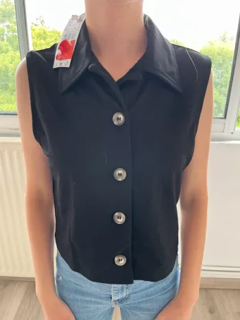 Haut mango sans manche noir XS neuf