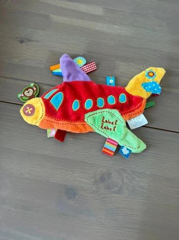 Doudou plat Label-Label en forme d'avion
