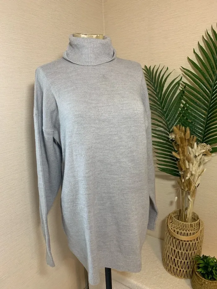 Pull long col roulé femme
