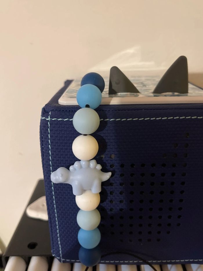 Cache poussière bleu dinosaure